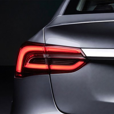 Silver Sedan Rear with Glowing Taillights