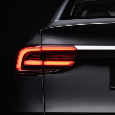 Black sedan with glowing red taillights