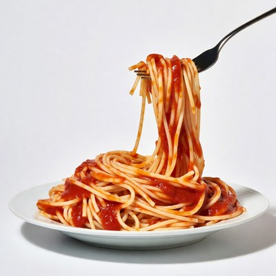 Spaghetti with marinara sauce on fork