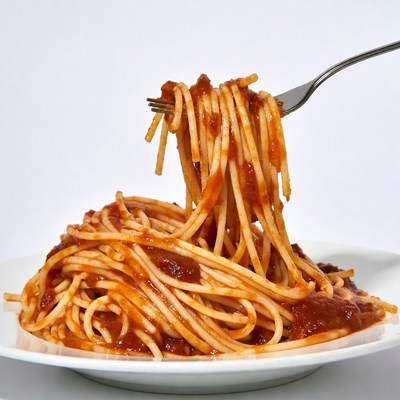 Spaghetti with marinara sauce on fork