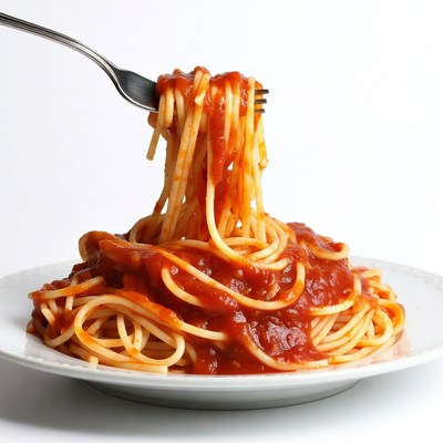 Fork lifting spaghetti with tomato sauce