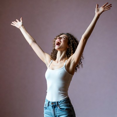 Woman raising arms joyfully