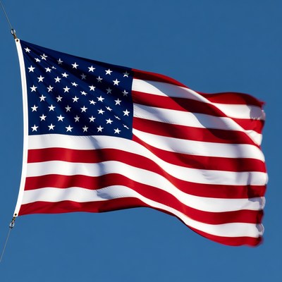 American Flag Waving in Blue Sky