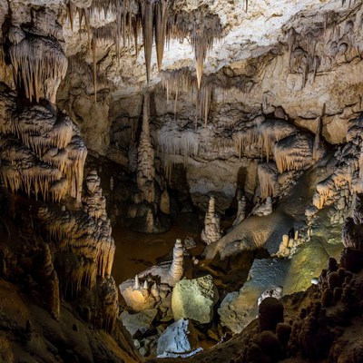 Stalactites in illuminated cave