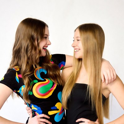 Two girls hugging and smiling