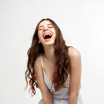 Young woman laughing joyfully