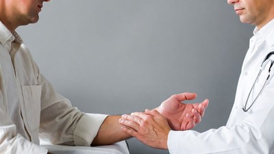 Doctor shaking hands with patient