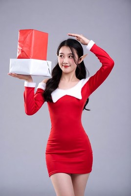 Asian woman in elf costume holding gifts