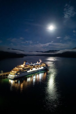 Cruise Ship Docked at Night with Moon
