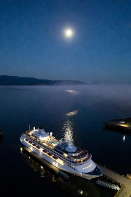 Cruise Ship Docked at Night with Moon