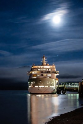 Cruise Ship Docked at Night with Moon