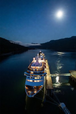 Cruise Ship Docked at Night with Moon