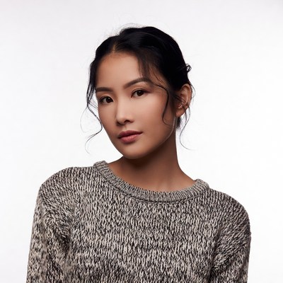 Asian woman in chunky sweater