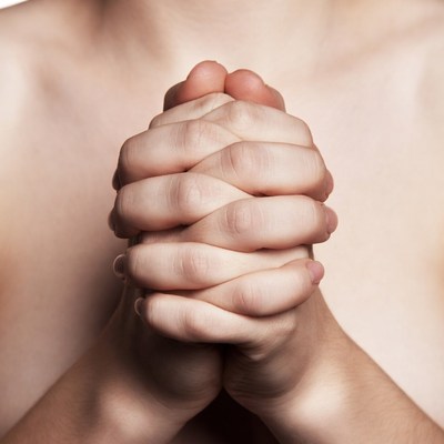 Hands pressed together in prayer