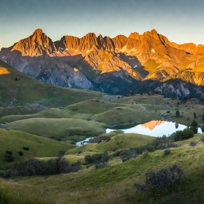 Sunrise over mountains and lake