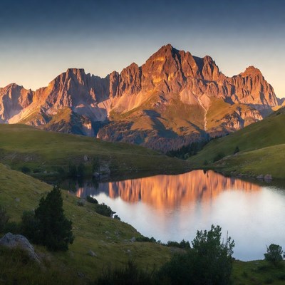 Mountain Range Reflecting in Lake at Sunset