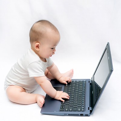 Asian baby using laptop