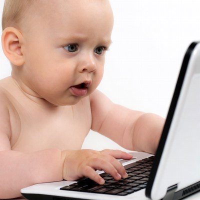 Baby using laptop computer