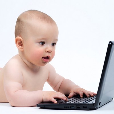 Baby using laptop computer