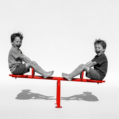 Two boys on red seesaw