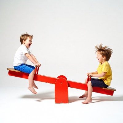 Two boys laughing on seesaw