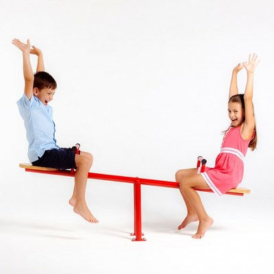 Boy and girl on seesaw