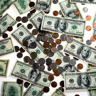 Pile of US Dollars and Coins