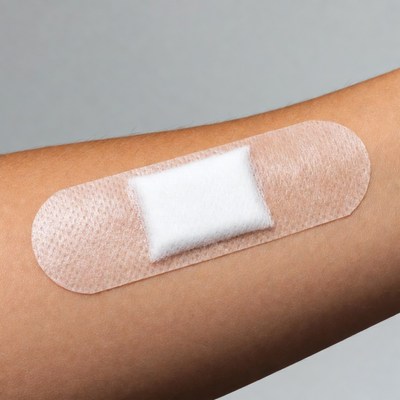 Adhesive bandage on arm