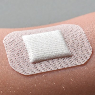 White bandage on arm