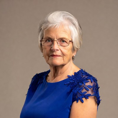 Elderly woman in blue lace dress