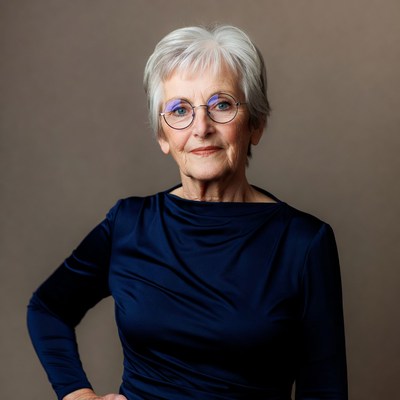 Elderly woman with glasses smiling