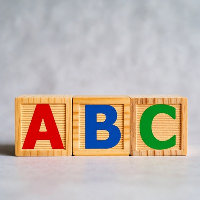 Wooden ABC Blocks on Gray Background