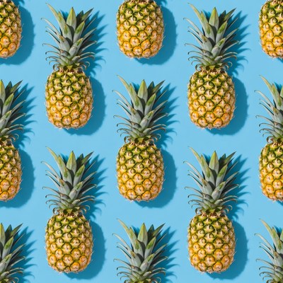 Pineapples on Blue Background