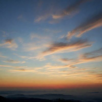 Sunset Sky Over Misty Mountains