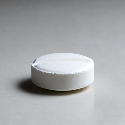 White pill on gray surface