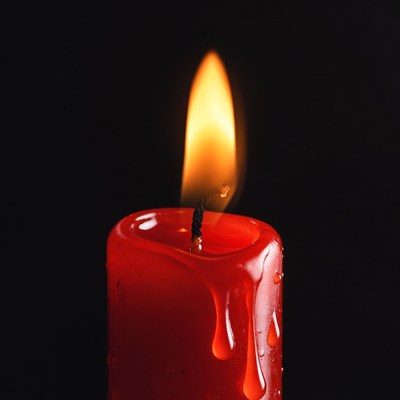Red Burning Candle with Dripping Wax