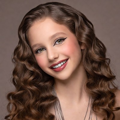 Smiling girl with wavy brown hair