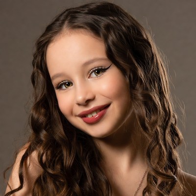 Smiling girl with curly brown hair