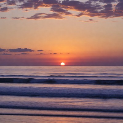 Sunset over ocean waves