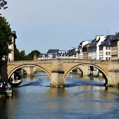 Stone Bridge over River with Tourists