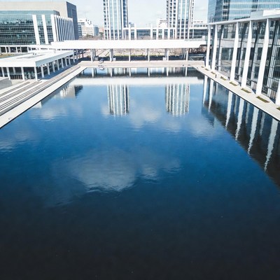 Modern Buildings Reflecting in Rectangular Pool