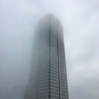 Tall Skyscraper in Dense Fog