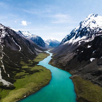 Turquoise River in Snowy Mountains