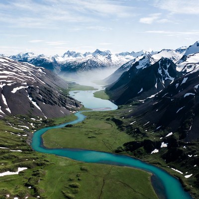 Turquoise River in Snowy Mountains