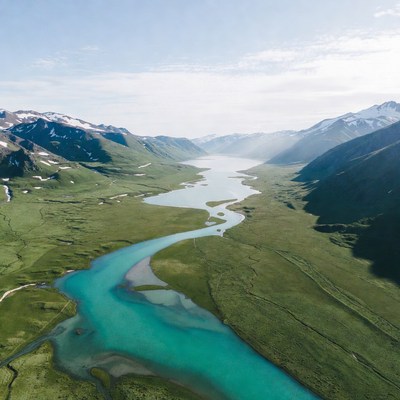 Turquoise River in Snowy Mountains
