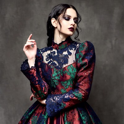 Woman in ornate lace gown
