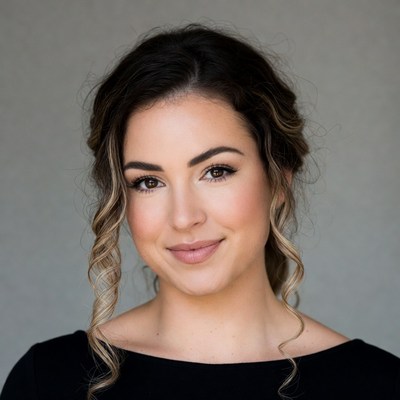 Smiling woman with curly updo