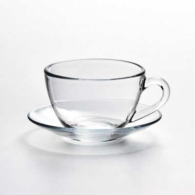 Clear glass teacup with saucer