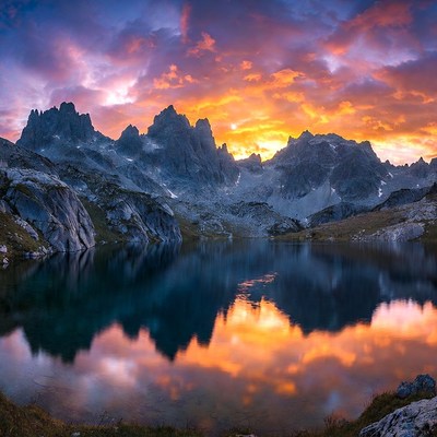 Mountain Lake Reflecting Vibrant Sunset