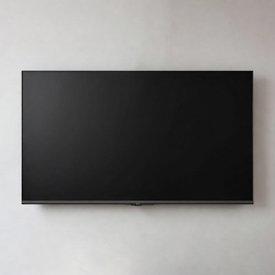 Black flat screen TV on white wall